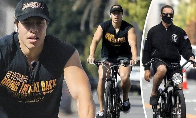 Arnold Schwarzenegger - Joseph Baena - Arnold Schwarzenegger's son Joseph Baena rides bike in LA narrowly missing his dad who's nearby - dailymail.co.uk - Los Angeles - state California - city Los Angeles