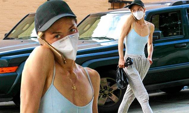 Jaime King shows off her toned arms in skintight blue tank top as she takes a call through face mask - dailymail.co.uk - city Hollywood