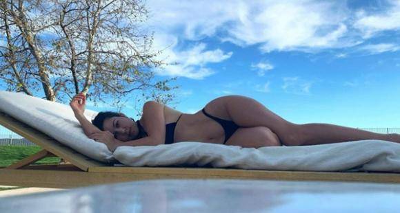 Kourtney Kardashian - Kourtney Kardashian flaunts her curves in black bikini as she soaks up the sun by poolside; See Photos - pinkvilla.com - state California