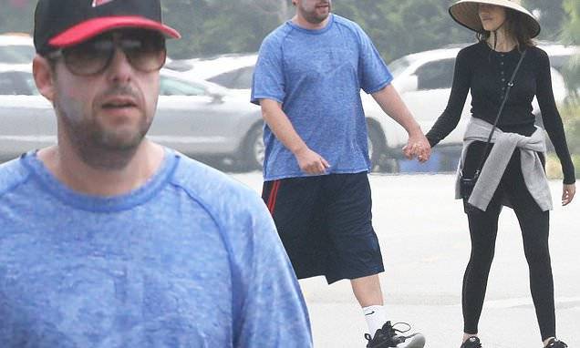 Adam Sandler - Adam Sandler and wife Jackie hold hands during romantic stroll in Malibu amid COVID-19 lockdown - dailymail.co.uk - state California - city Malibu, state California - city Sandler