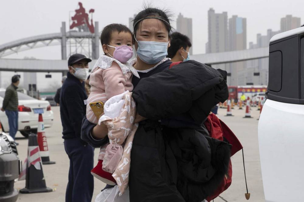 Chinese struggle to return to work as virus controls ease - clickorlando.com - China - city Wuhan