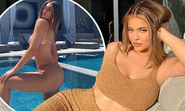 Kylie Jenner - Kim Kardashian - Kylie Jenner displays her lithe physique as she curls up on the couch wearing Skims - dailymail.co.uk