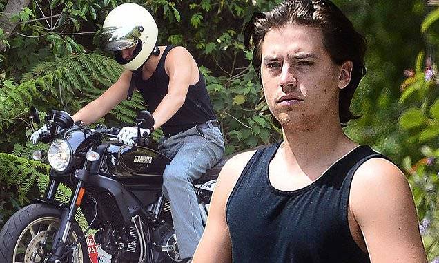 Cole Sprouse - Cole Sprouse shows off guns in black tank top as he takes motorcycle out during quarantine break - dailymail.co.uk - Italy - Los Angeles
