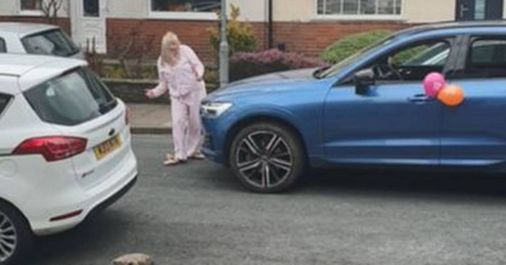 Watch: Bank manager gives her sister a birthday surprise with 'pyjama street rave' outside Bolton home - manchestereveningnews.co.uk