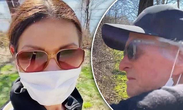 Michael Douglas - Catherine Zeta-Jones dons a face mask while 'getting some fresh air' on a walk with Michael Douglas - dailymail.co.uk - county Douglas