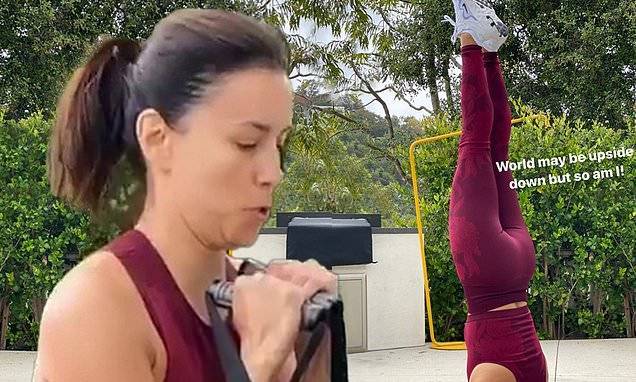 Eva Longoria - Eva Longoria shows off her impressive yoga headstand: 'The world may be upside down but so am I' - dailymail.co.uk