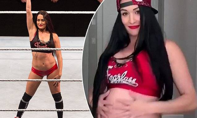 Nikki Bella - Nikki Bella shows off her baby belly dancing in WWE uniform... after she and Brie enter Hall Of Fame - dailymail.co.uk
