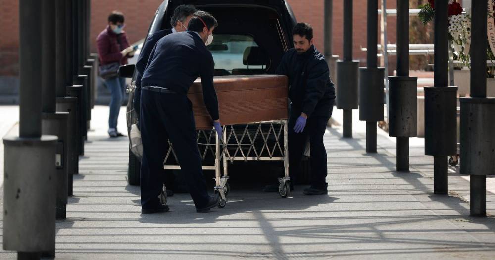 Heartbreaking 'drive through' funerals as Spain's coronavirus death toll rises - mirror.co.uk - Spain - city Madrid