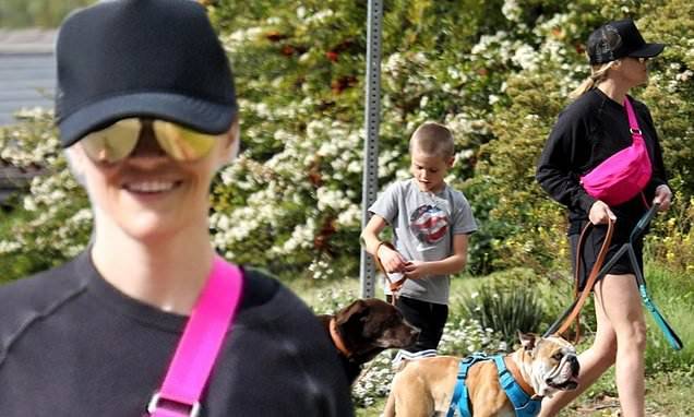 Reese Witherspoon - Reese Witherspoon is sporty in black as she walks three dogs in LA with help from son Tennessee, 7 - dailymail.co.uk - state Tennessee