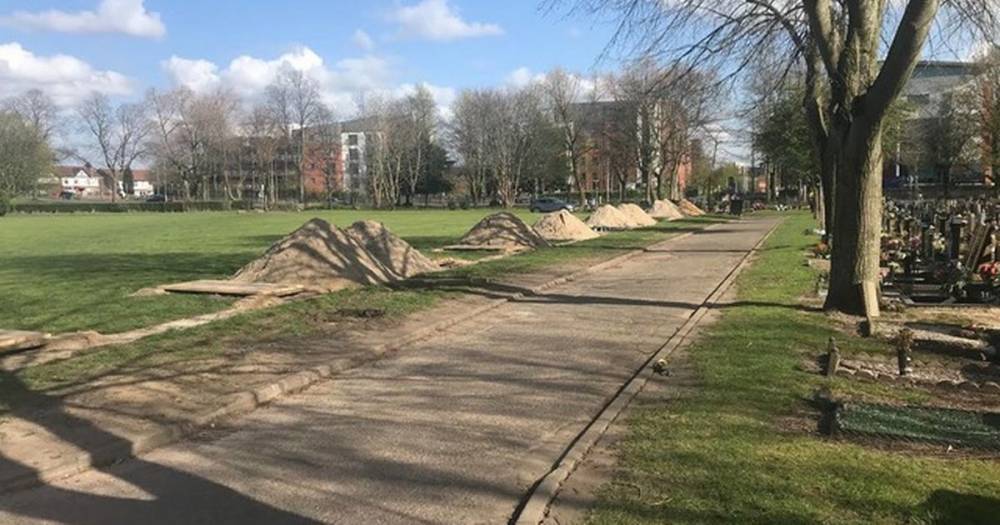 Mounds of earth left heaped next to new graves in Southern Cemetery...they have been dug in case workers have to self-isolate - manchestereveningnews.co.uk - city Manchester