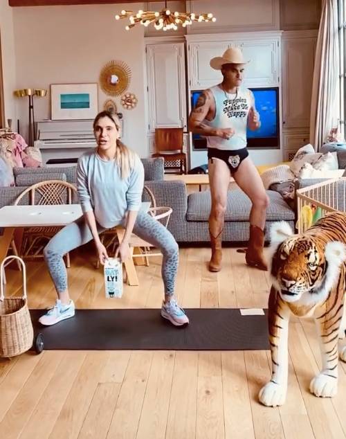 Robbie Williams - Carole Baskin - Robbie Williams strips to his famous tiger pants in Tiger King workout video with wife Ayda Field - thesun.co.uk - Los Angeles