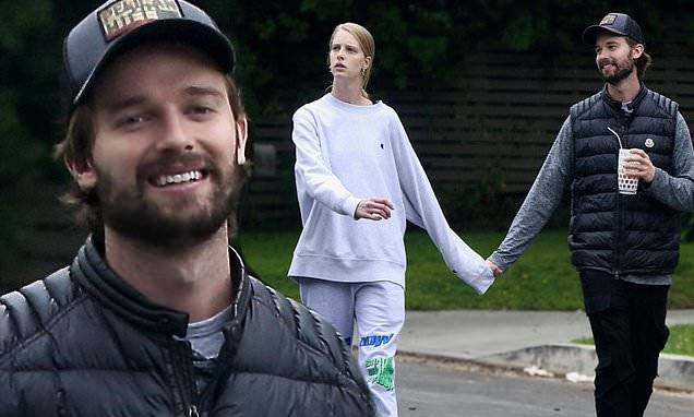 Patrick Schwarzenegger - Patrick Schwarzenegger is all smiles as he holds hands with Abby Champion on a walk outside - dailymail.co.uk - Los Angeles - state California