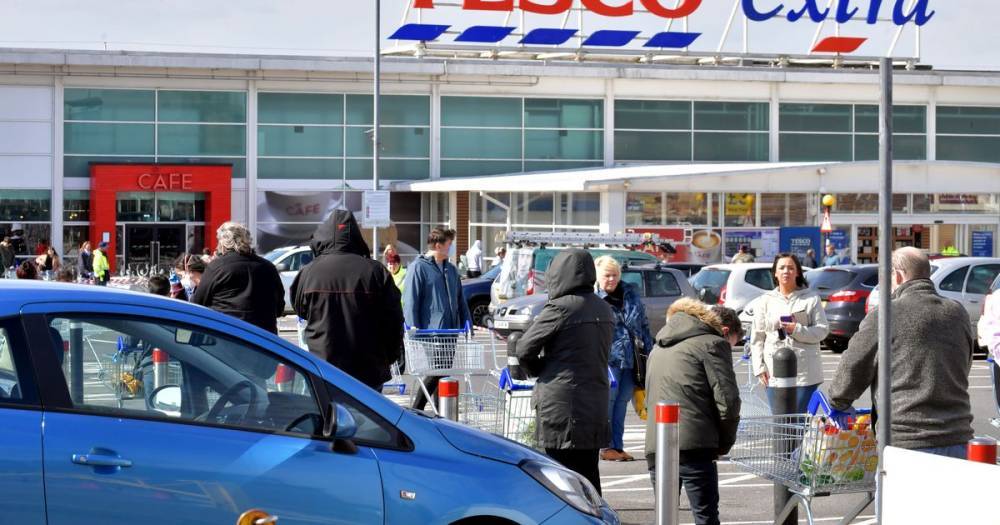 Tesco asks shoppers to visit stores as it can't meet online demand after panic-buyers clear shelves - manchestereveningnews.co.uk - Britain