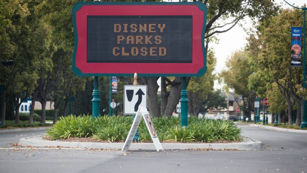 Bob Iger - Disney Stock Downgraded Over Dim Theme Parks Forecast - hollywoodreporter.com - county Wells - city Fargo, county Wells