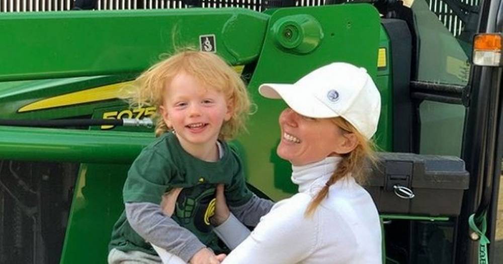 Geri Halliwell cuddles son as they ride tractor on her sprawling country estate - mirror.co.uk