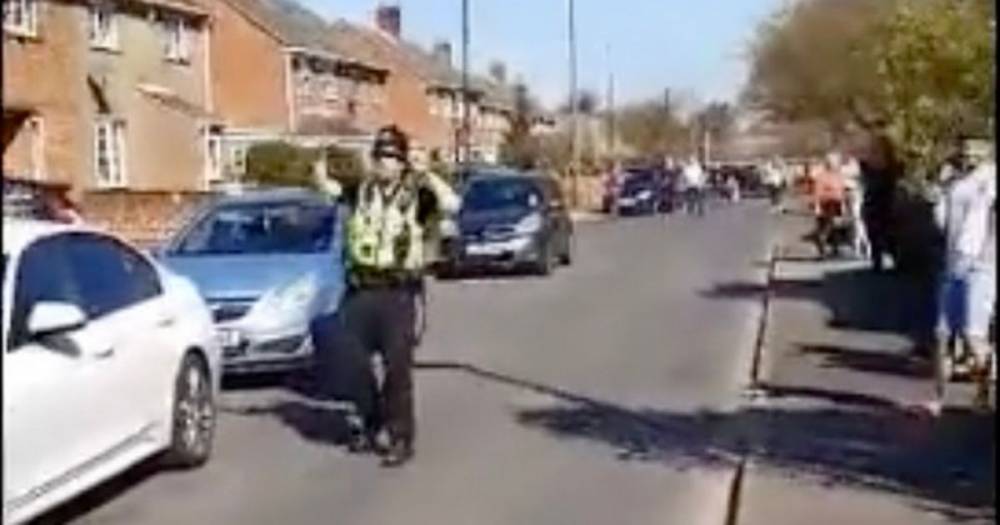 Tim Scott - Coronavirus: Police cheer up stay-at-home residents with surprise street dance - dailystar.co.uk