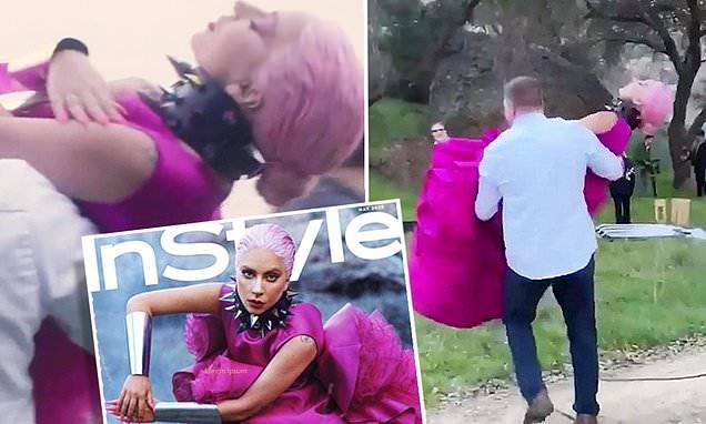 Lady Gaga is CARRIED to her photoshoot while decked out in elaborate pink gown - dailymail.co.uk