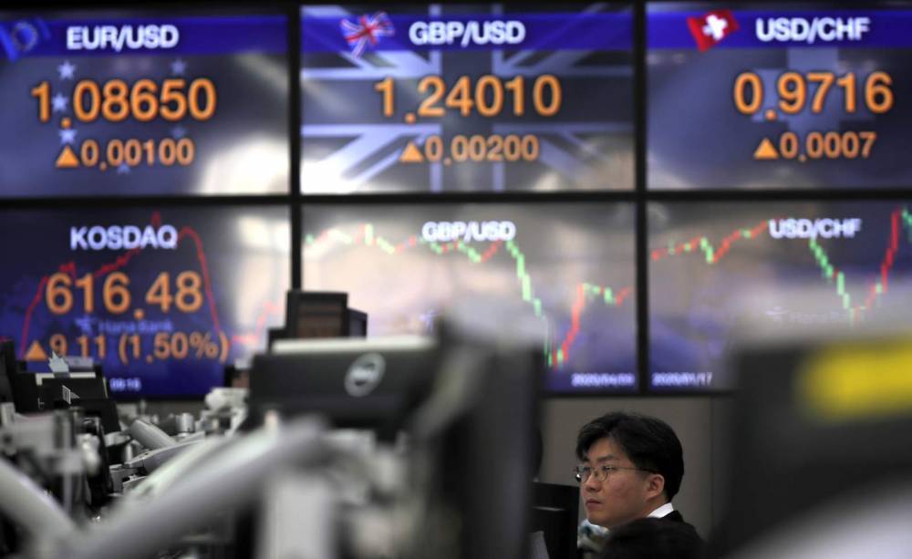 Asian shares mostly higher, lockdown feud drags Tokyo lower - clickorlando.com - Japan - Hong Kong - city Bangkok - city Tokyo - city Shanghai