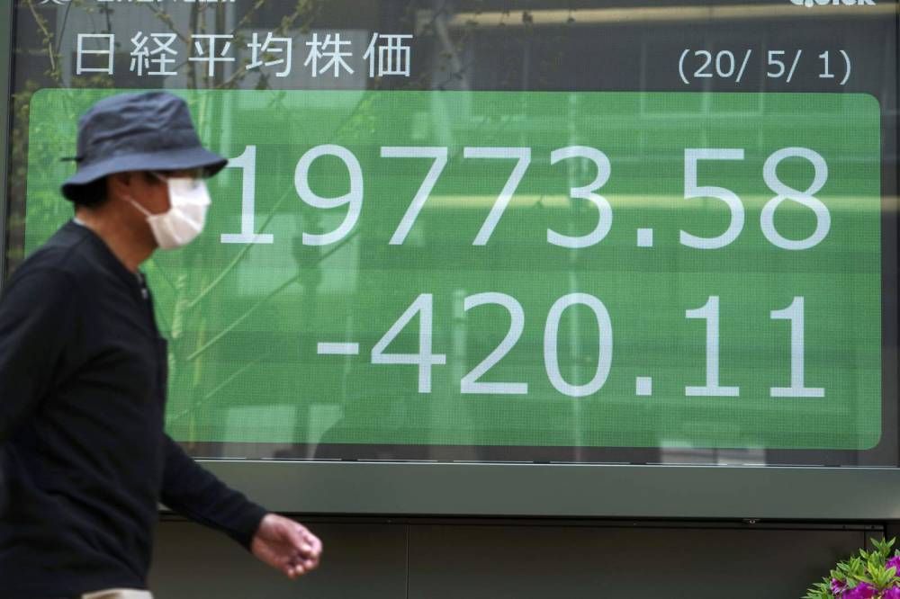 Asian shares fall after Wall St slips on grim economic news - clickorlando.com - Japan - Australia