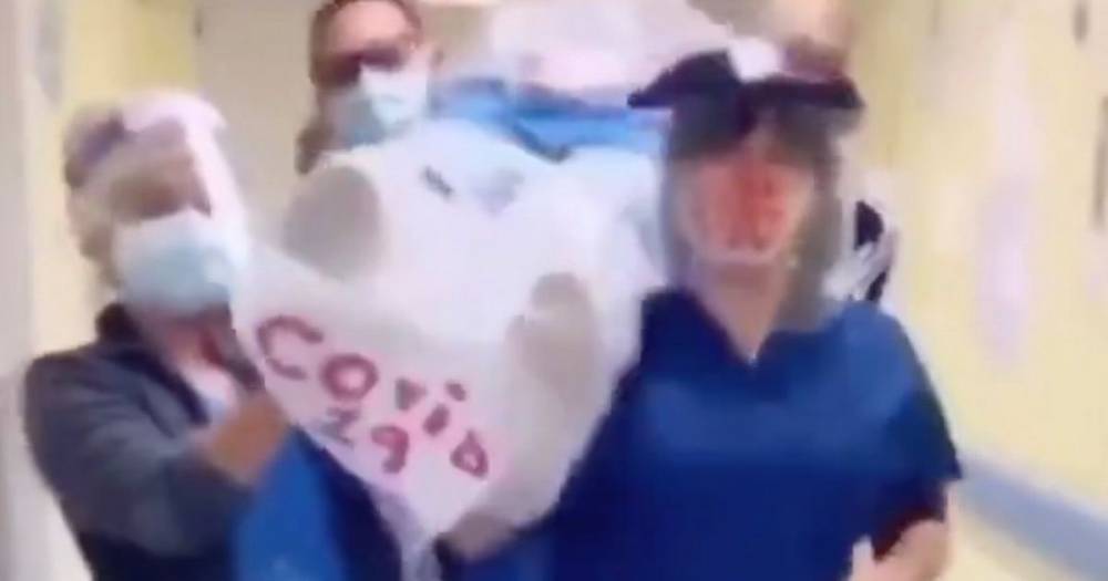 Dancing nurses carry 'coronavirus victim' in disturbing clip copying TikTok meme - dailystar.co.uk
