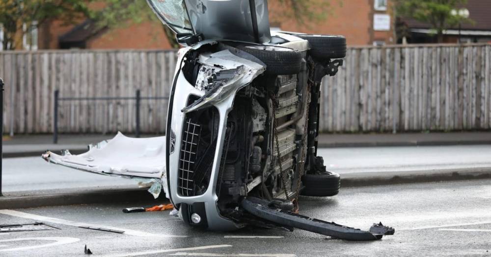 Woman and teenage girl taken to hospital after car 'hits barrier' and flips onto side - manchestereveningnews.co.uk - city Manchester