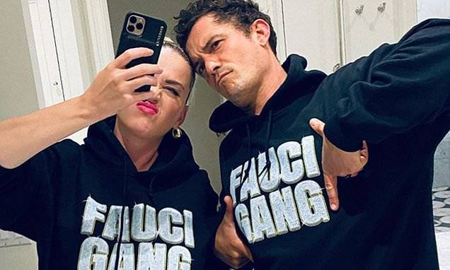 Anthony Fauci - Orlando Bloom - Katy Perry and Orlando Bloom model 'Fauci Gang' hoodies - dailymail.co.uk