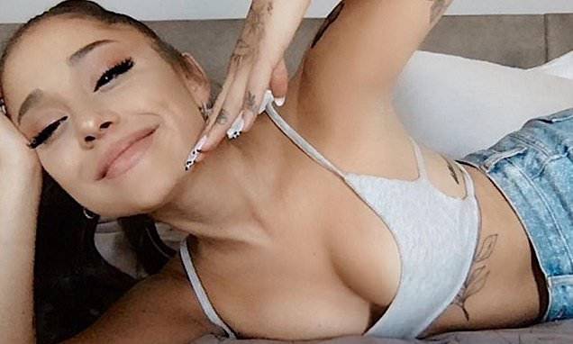Ariana Grande - Ariana Grande shows off her recent tattoo collection she lounges at home in a bra and jeans - dailymail.co.uk