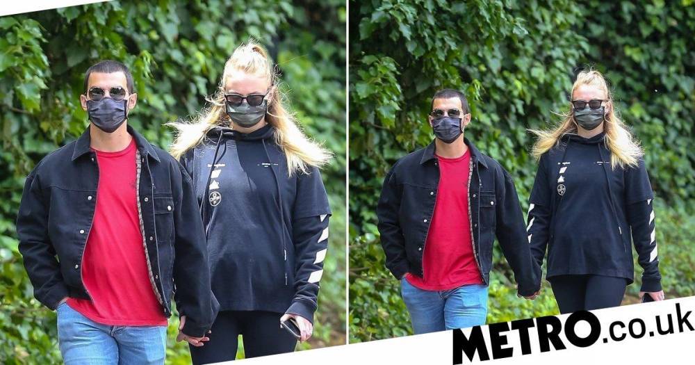 Joe Jonas - Sophie Turner and Joe Jonas make even lockdown look cool in matching masks amid ‘pregnancy’ rumours - metro.co.uk - state California