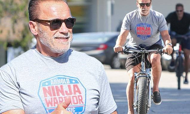 Arnold Schwarzenegger - Ralf Moeller - Arnold Schwarzenegger gives the thumbs up as he heads out on his daily bike ride - dailymail.co.uk - state California