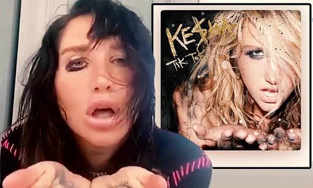 Kesha smudges black eyeliner on her hands and face as she recreates Tik Tok album cover - dailymail.co.uk