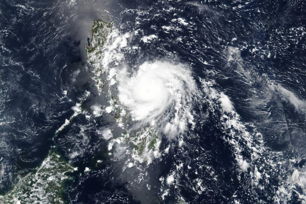Philippines riding out typhoon after virus slows evacuations - clickorlando.com - Philippines - city Manila