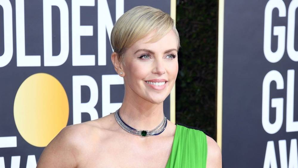 Charlize Theron - Charlize Theron Shares Rare Photo of Herself With Daughter Jackson on the Set of ‘Mad Max’ - etonline.com