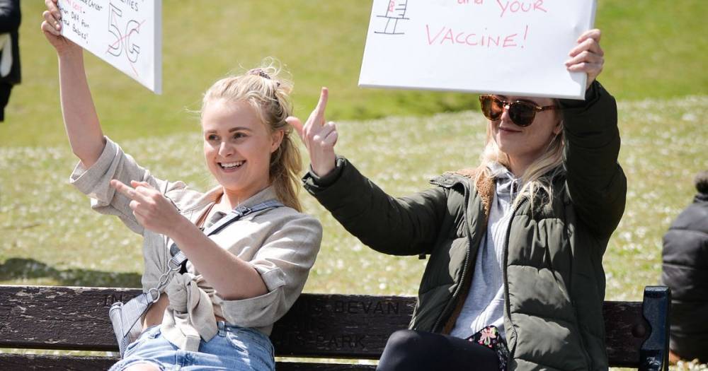People gather to protest against plans for a coronavirus vaccine and the government's handling of lockdown - manchestereveningnews.co.uk - city Manchester