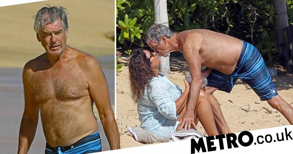 James Bond - Pierce Brosnan channels his inner James Bond and plants a kiss on wife Keely Shaw Smith in Hawaii - metro.co.uk - county Smith - county Pierce - state Hawaii