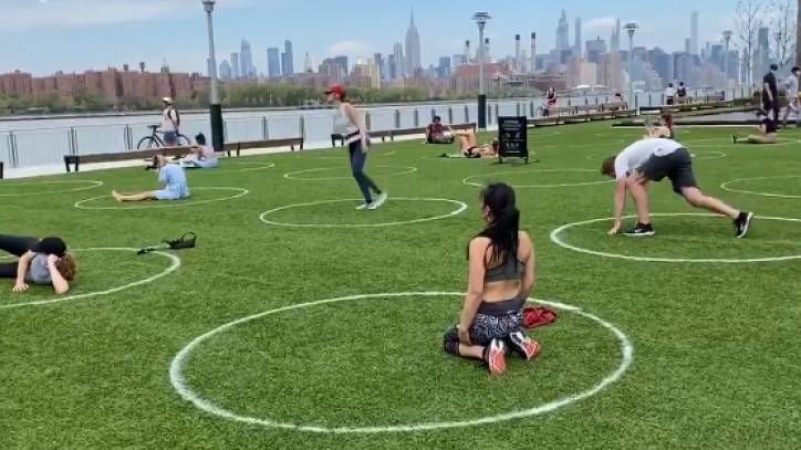 New York City enforcing social distancing with circles on grass, distance signs - fox29.com - New York - county Park - county York