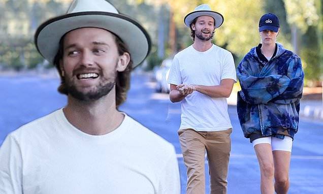 Patrick Schwarzenegger - Patrick Schwarzenegger looks casual as he enjoys the sunshine on a walk with girlfriend - dailymail.co.uk - county Patrick