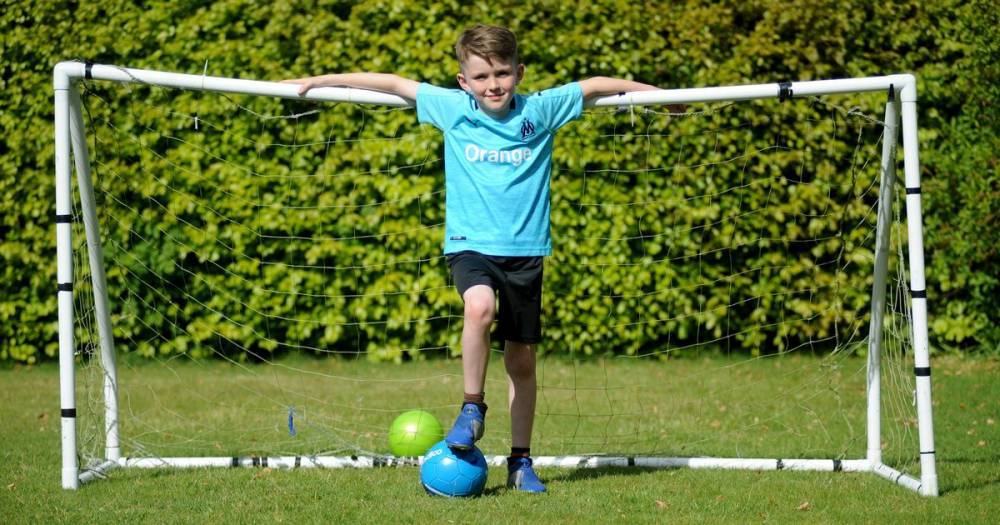 Tom Moore - Lockerbie youngster boosts NHS with 10-hour garden free kick-a-thon - dailyrecord.co.uk