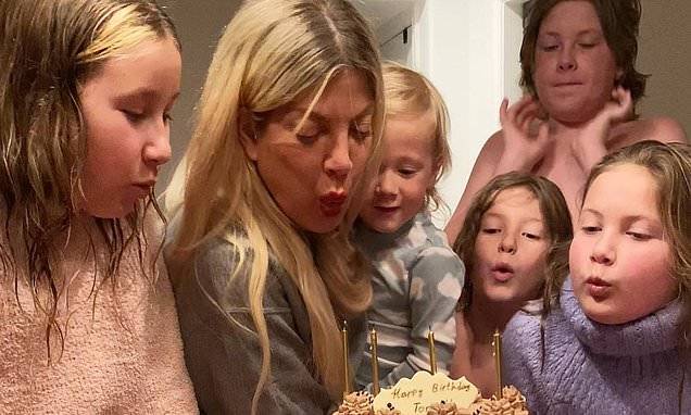 Tori Spelling celebrates her 47th birthday with a chocolate cake - dailymail.co.uk