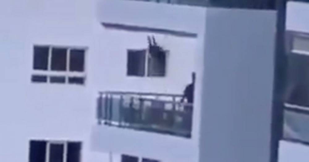 Heart-stopping moment dad pushes daughter on eighth-floor balcony swing - dailystar.co.uk - Puerto Rico - Mexico