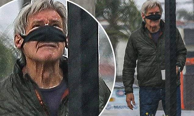 Harrison Ford adjusts his face mask to drink a cup of coffee at Hawthorne Airport - dailymail.co.uk - state Indiana - county Harrison - county Ford