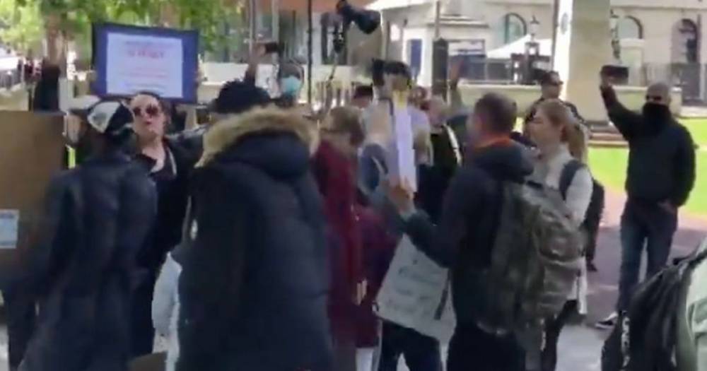 Anti-lockdown protesters filmed hugging in mass group in front of police - dailystar.co.uk - Scotland
