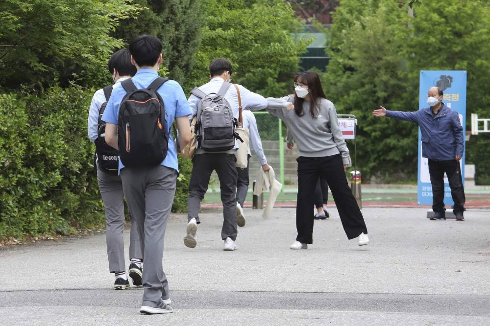 Asia Today: S Korean students return to class; 32 new cases - clickorlando.com - South Korea - city Seoul - North Korea