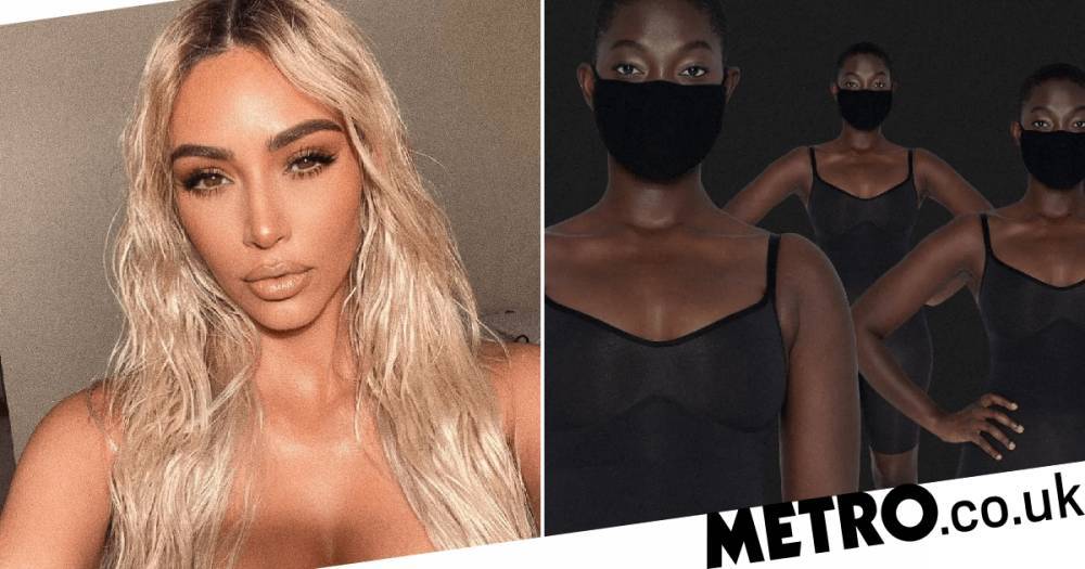 Kim Kardashian - Kim Kardashian accused of being ‘tone-deaf’ over black SKIMS face masks described as ‘nude’ for black women - metro.co.uk
