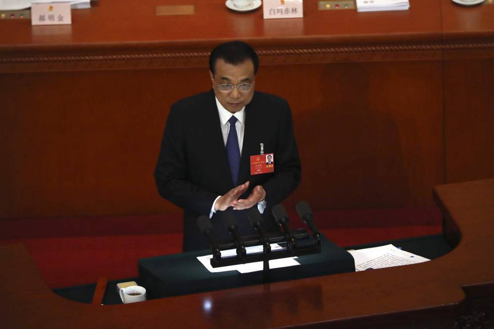 Li Keqiang - China promises stimulus spending, sets no growth target - clickorlando.com - China - city Beijing