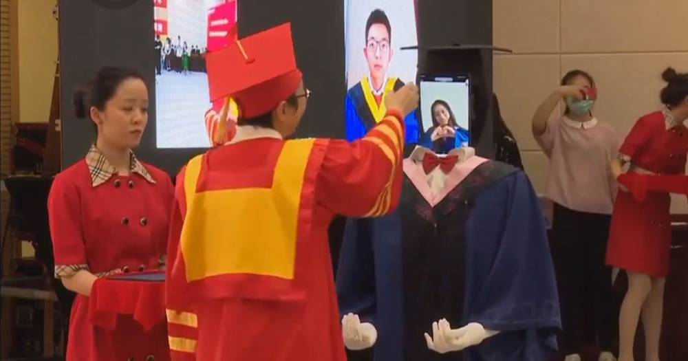 Student 'robots' with tablet heads mime graduation ceremony in uncanny video - dailystar.co.uk - China