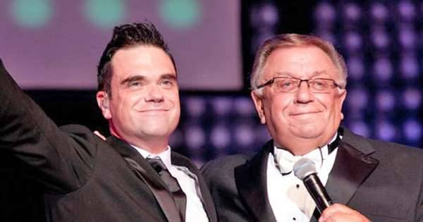 Robbie Williams - Robbie Williams opens up on ‘fear and panic’ as his dad is diagnosed with Parkinson’s disease - msn.com