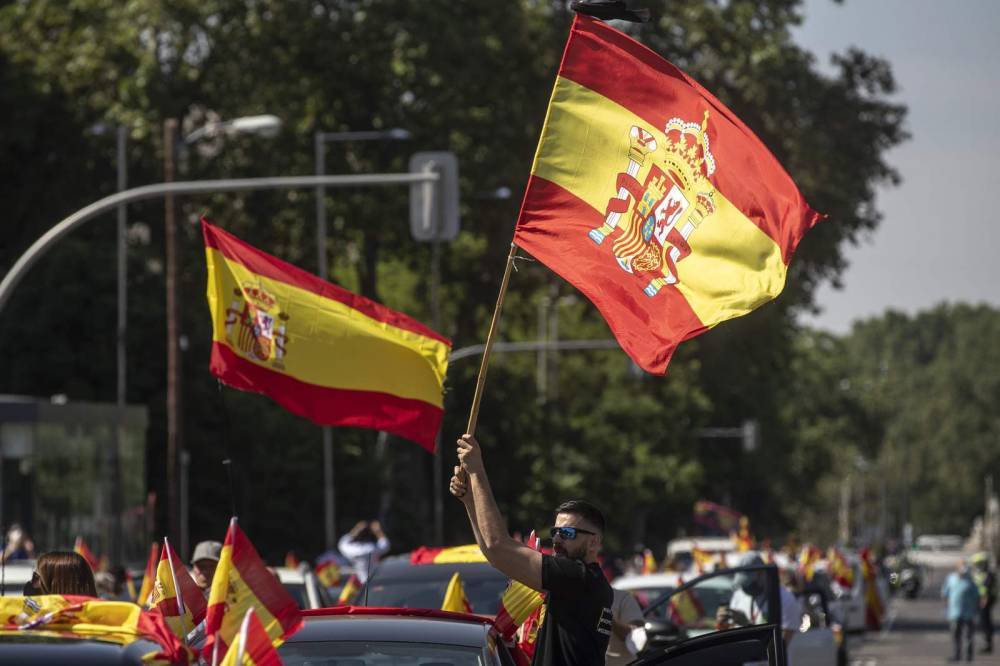 Spain’s far-right holds car protest against virus lockdown - clickorlando.com - Spain - city Madrid - county Liberty