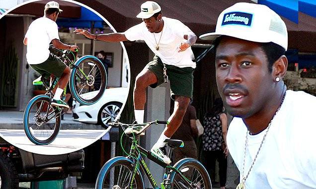 Tyler The Creator shows off his impressive bike skills as he rides around Venice - dailymail.co.uk
