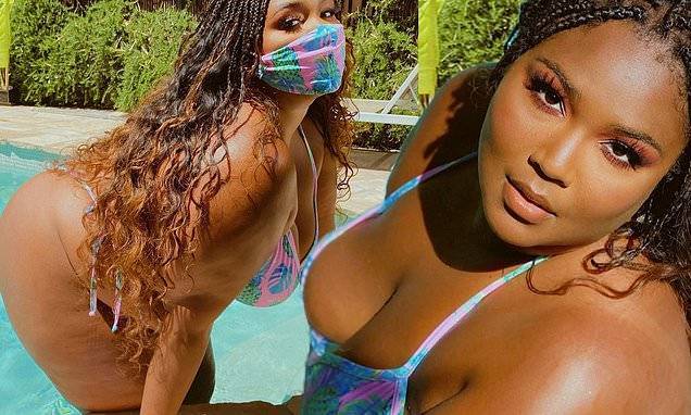 Lizzo twerks in racy pool video showing off her curves in a bikini with matching face mask - dailymail.co.uk