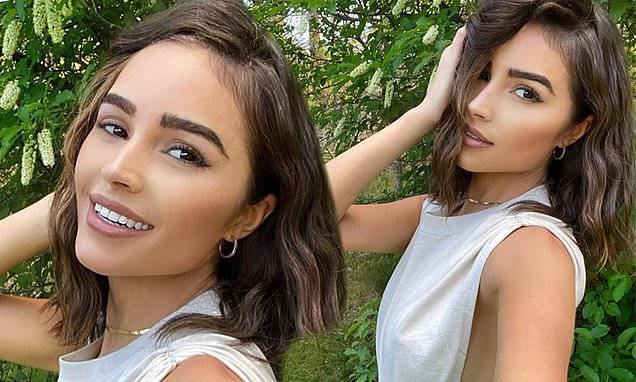 Olivia Culpo - Christian Maccaffrey - Olivia Culpo shares some sultry selfies in a white tank top while exploring nature - dailymail.co.uk